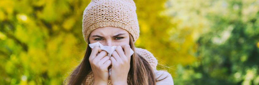 a woman blowing her nose