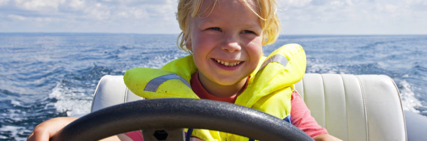 a child steering a boat