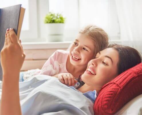 woman and child reading a book
