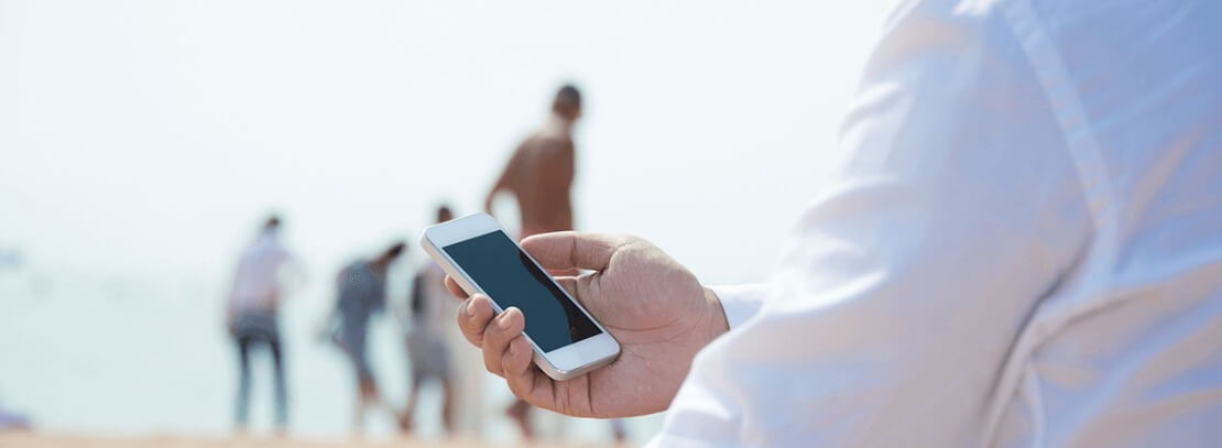 Man Staring at Shut Off Cell Phone