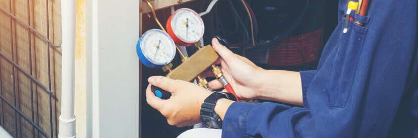 a technician testing an HVAC system