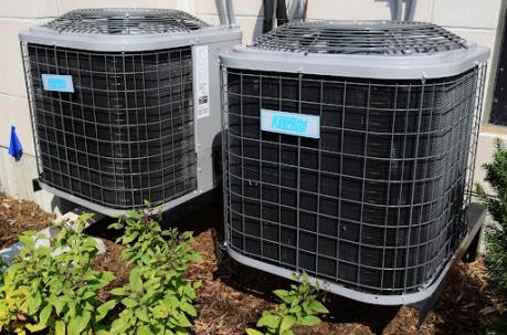 Leave Holland AC service on weathered units like these to our team of local HVAC experts.