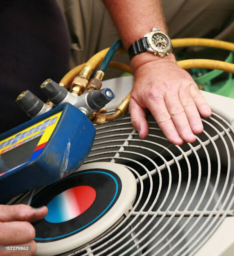 Mast Heating & Cooling technician completing AC maintenance check in Zeeland
        <div class=