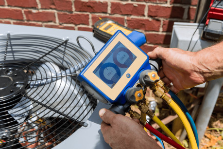 Technician testing an AC Repair in Holland