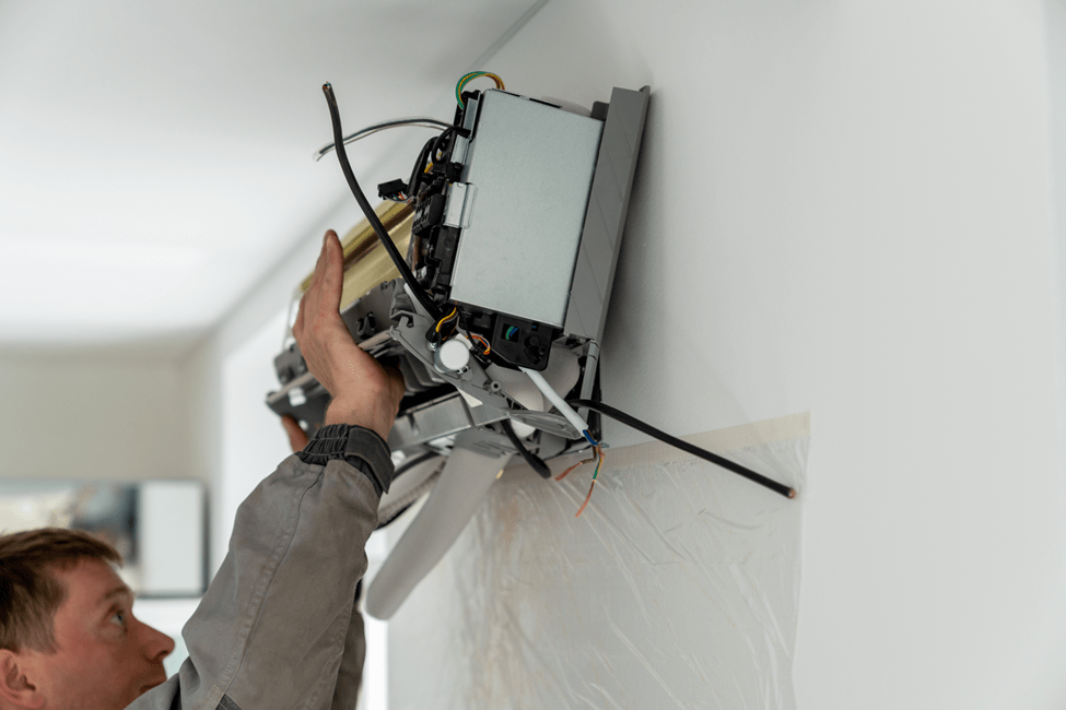 Technician working on a Zeeland ductless AC Repair