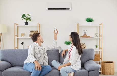Couple enjoying their renewed comfort after trusting Mast with their ductless AC repair in Holland